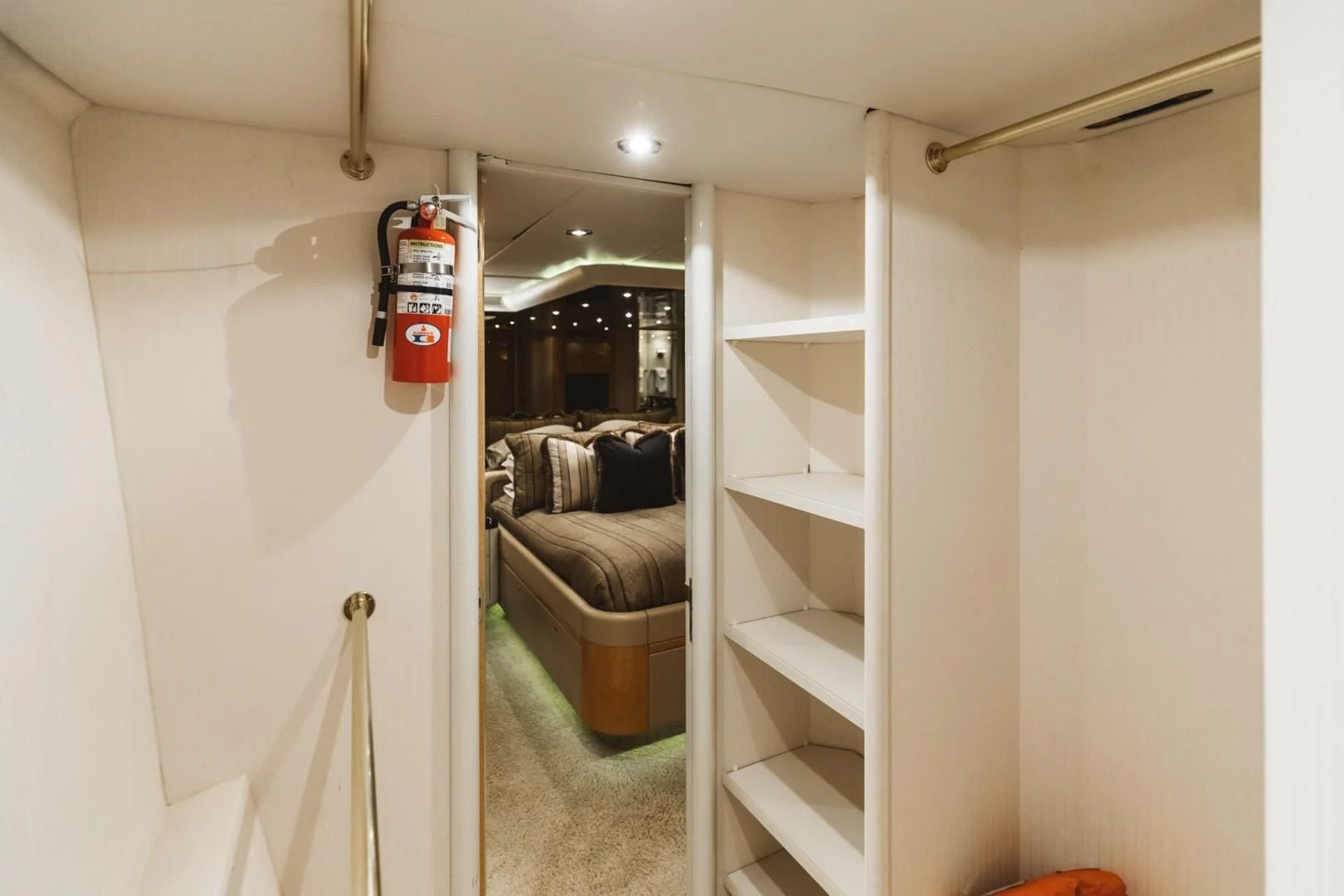 a room with a white shelf and a chair aboard DOUBLE EAGLE Yacht for Sale