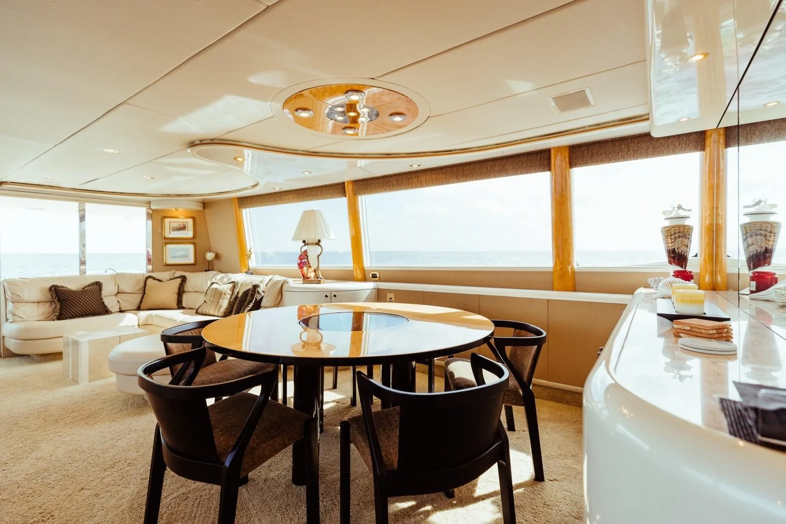 a living room with a large chandelier aboard DOUBLE EAGLE Yacht for Sale