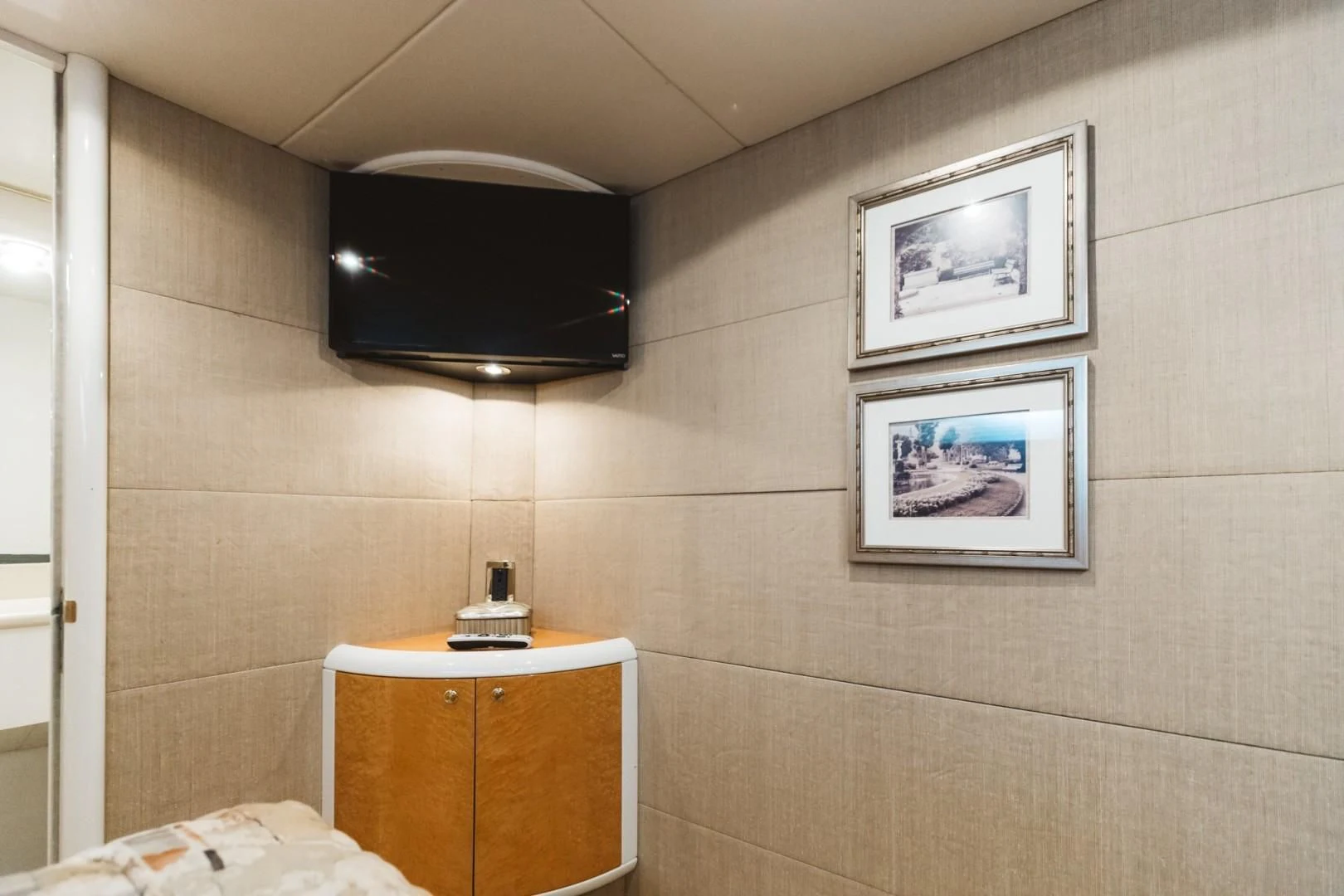 a bathroom with a television mounted on the wall aboard DOUBLE EAGLE Yacht for Sale