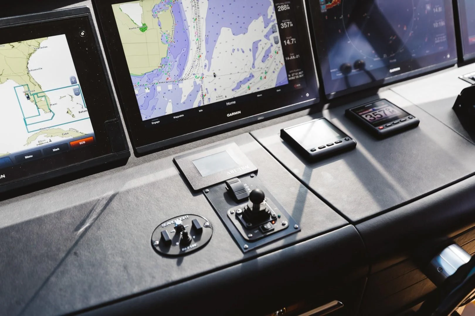 a group of electronic devices on a table aboard DOUBLE EAGLE Yacht for Sale