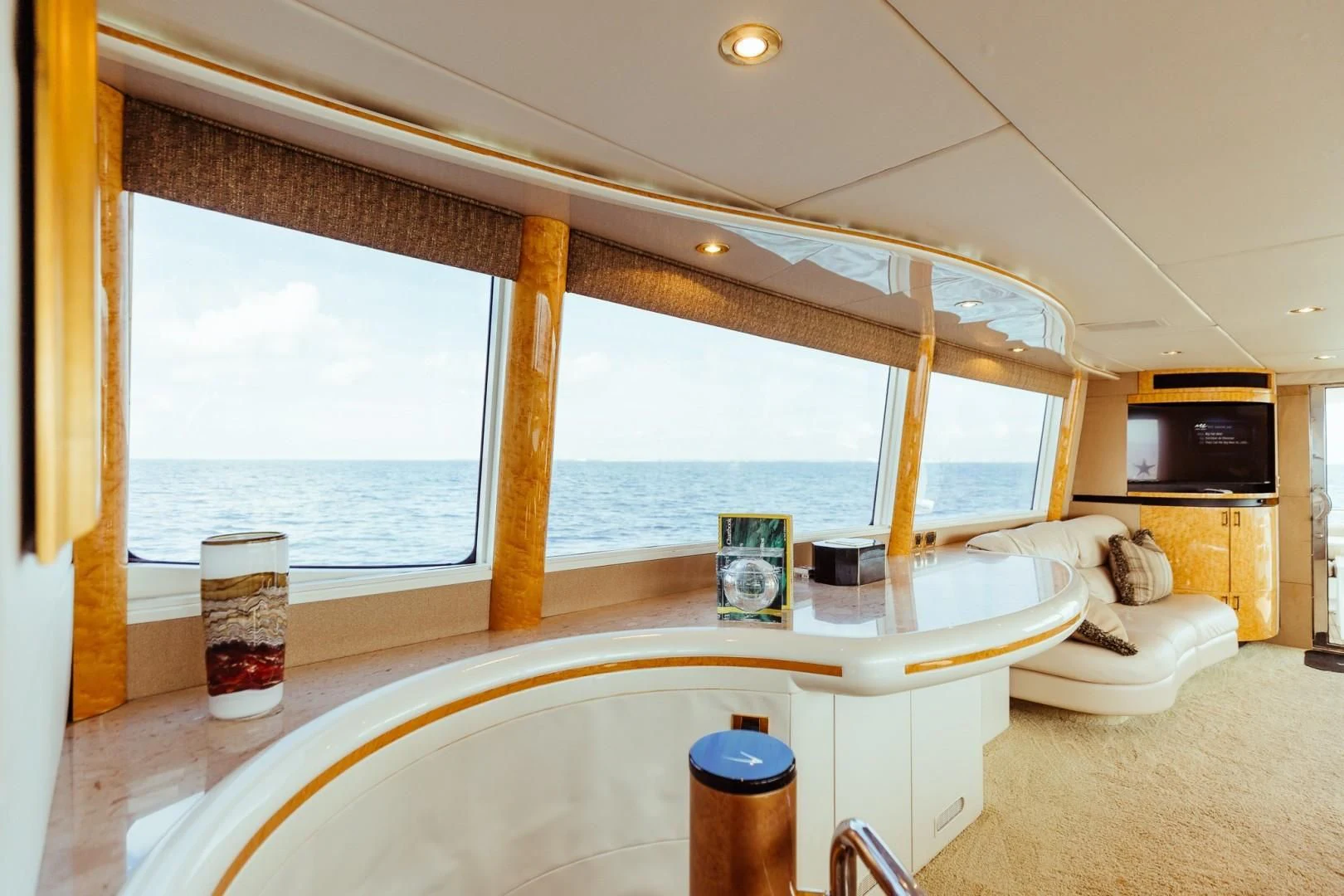 a room with a large window and a view of the ocean aboard DOUBLE EAGLE Yacht for Sale