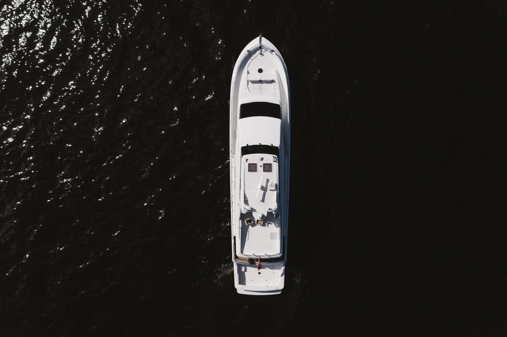 a white rocket with a black background aboard DOUBLE EAGLE Yacht for Sale