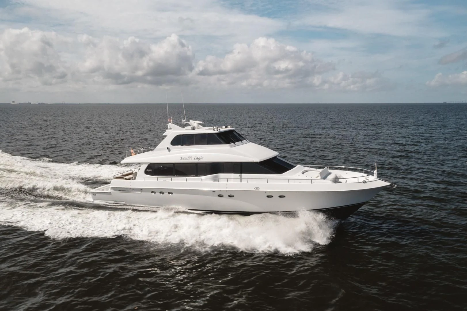 a white yacht splashing in the water aboard DOUBLE EAGLE Yacht for Sale