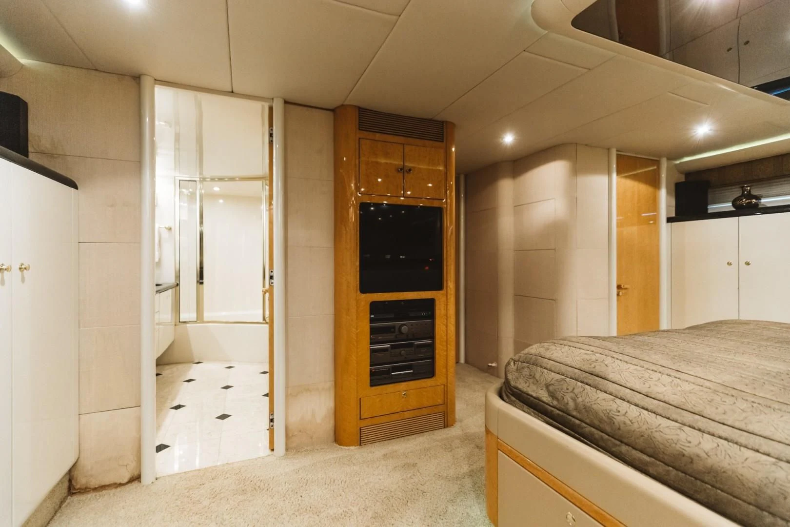 a bedroom with a bed and a closet aboard DOUBLE EAGLE Yacht for Sale