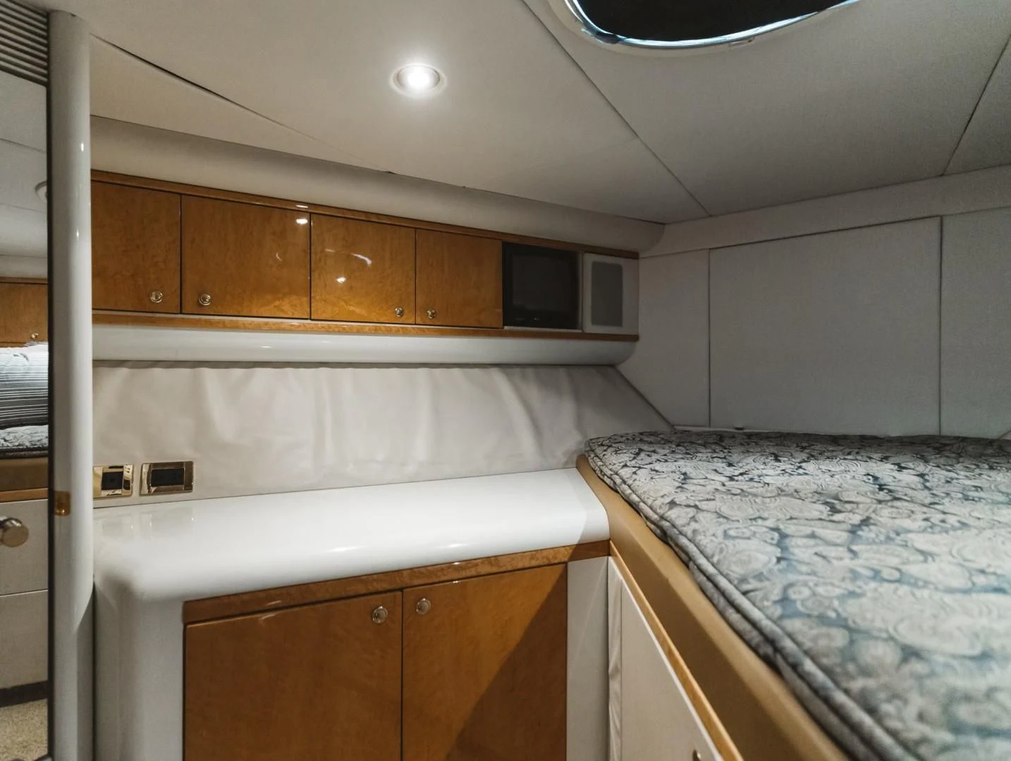 a kitchen with wooden cabinets aboard DOUBLE EAGLE Yacht for Sale
