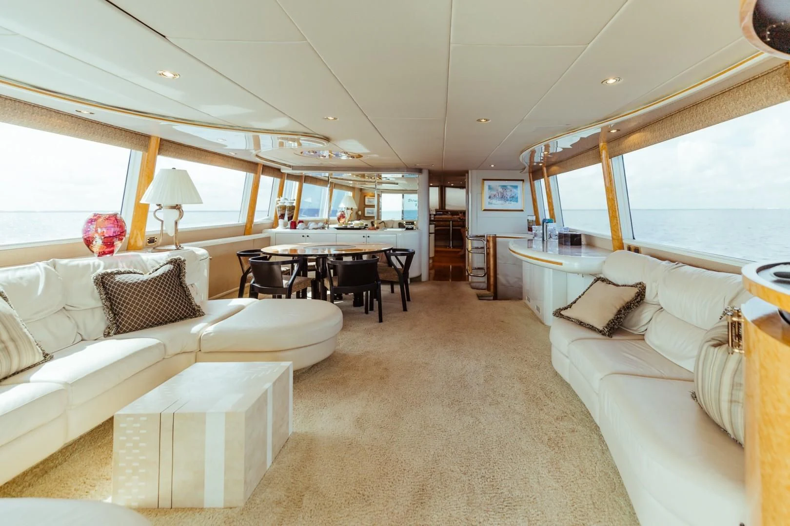 a living room with a large white couch and a table aboard DOUBLE EAGLE Yacht for Sale