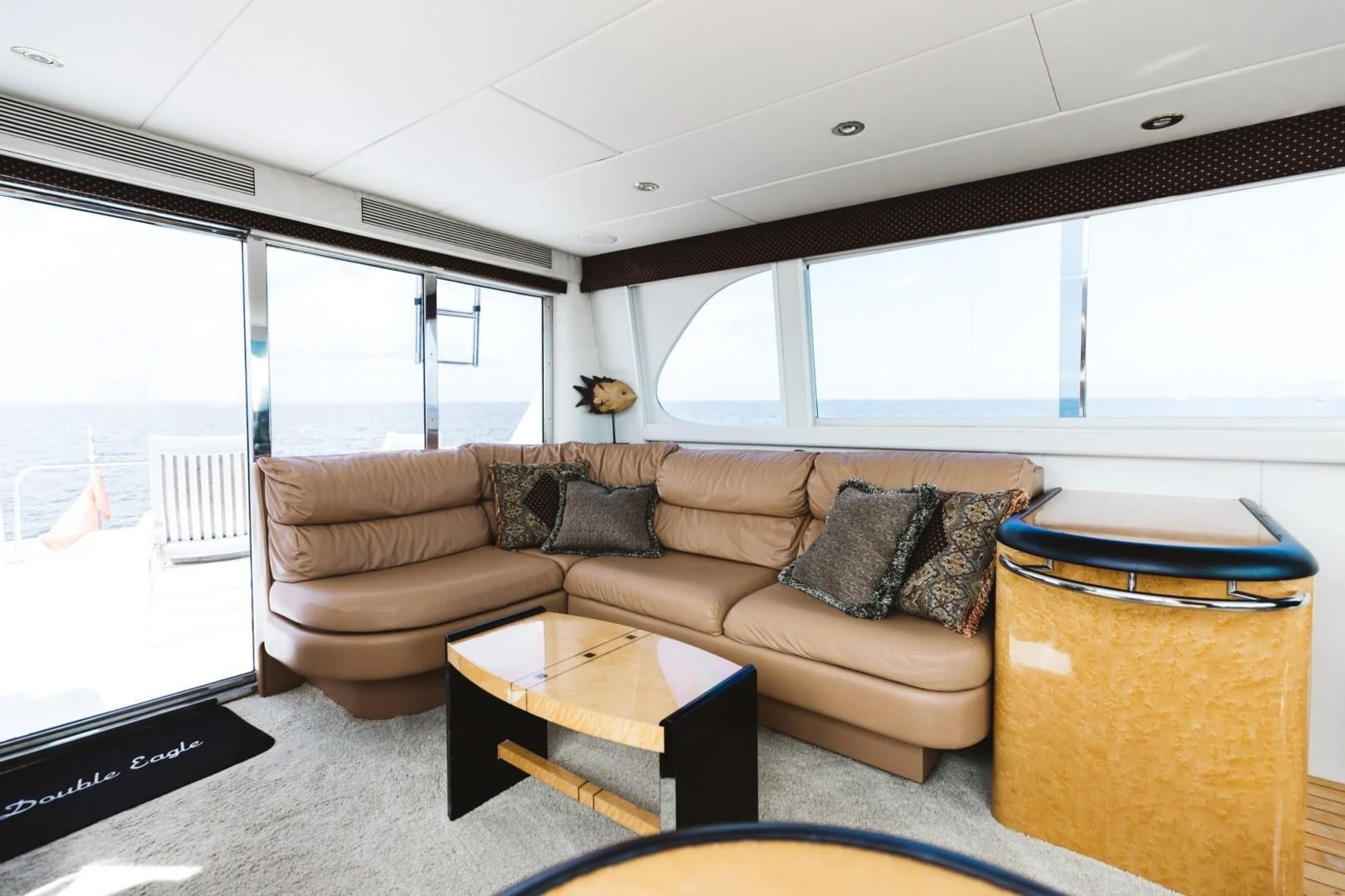 a living room with a couch and a coffee table aboard DOUBLE EAGLE Yacht for Sale