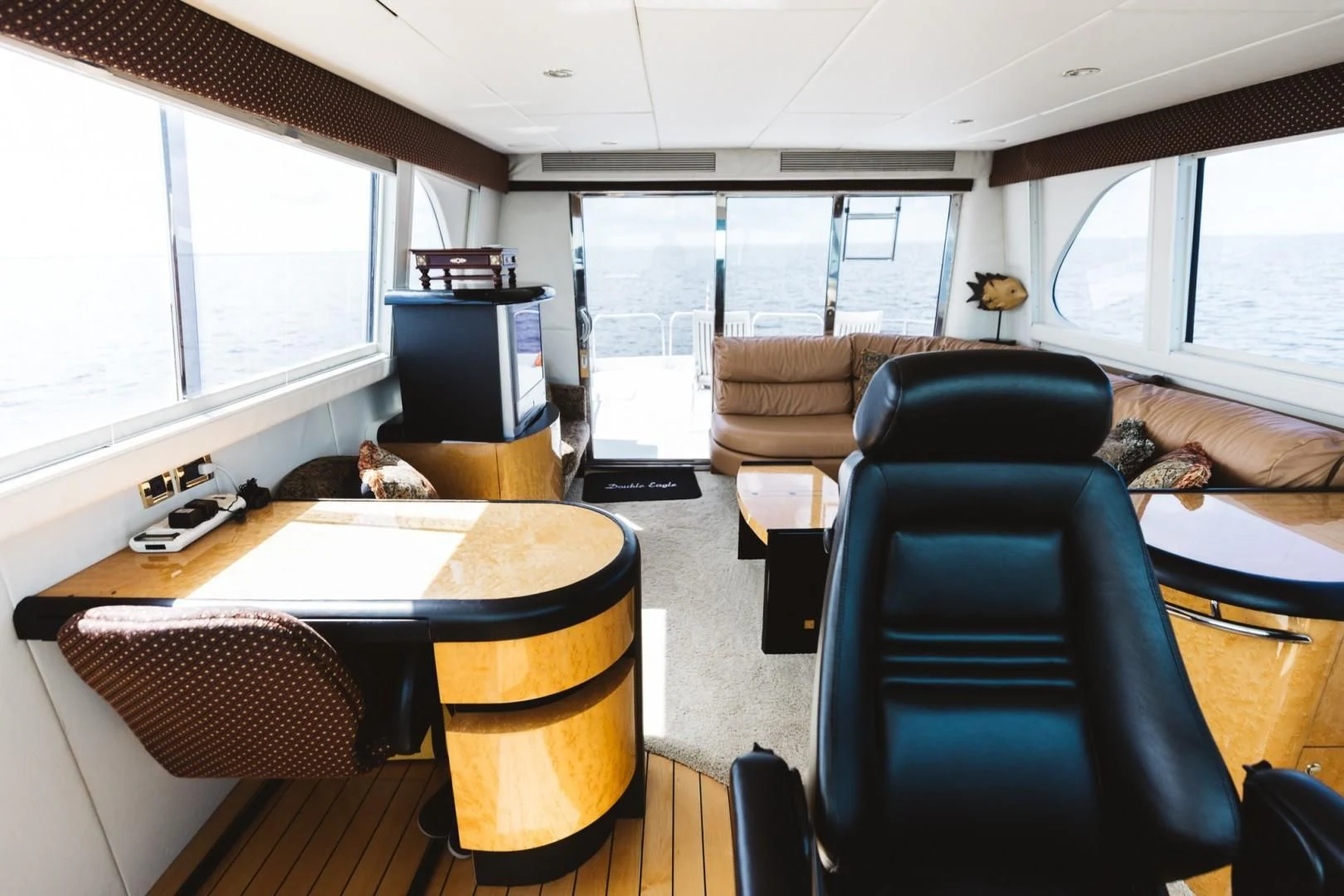 a living room with a couch and a desk aboard DOUBLE EAGLE Yacht for Sale