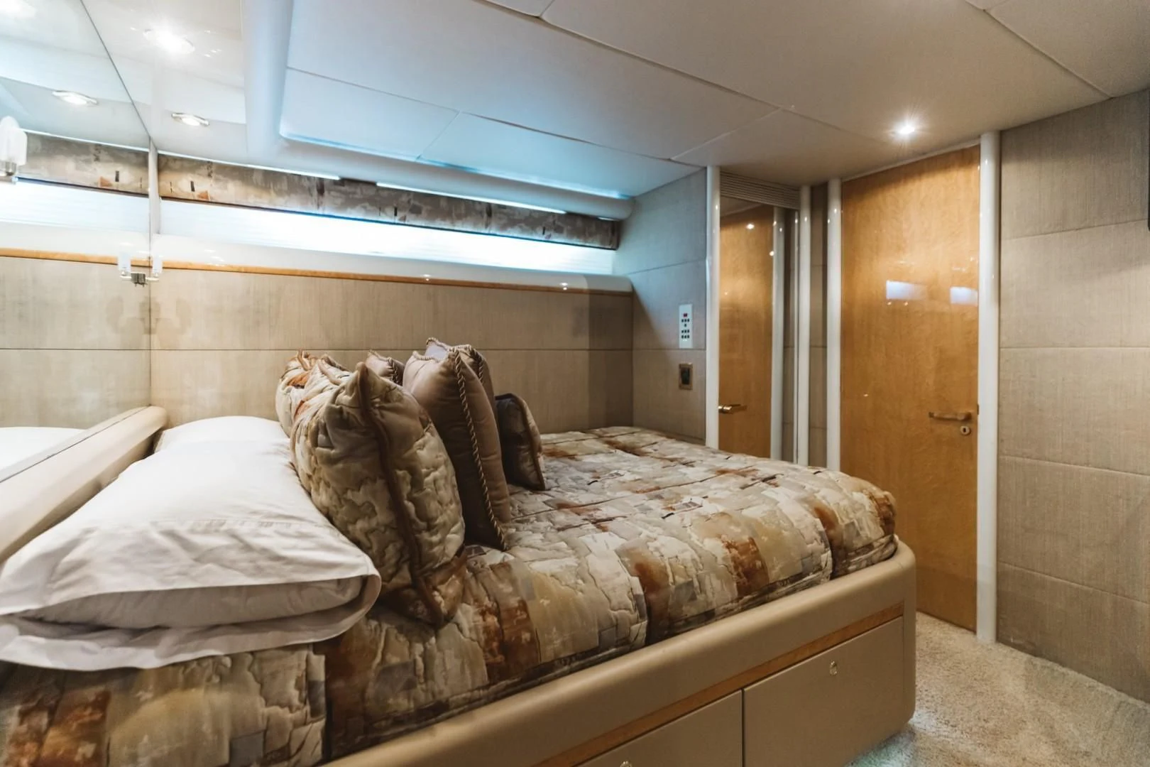 a room with a bed and a mirror aboard DOUBLE EAGLE Yacht for Sale