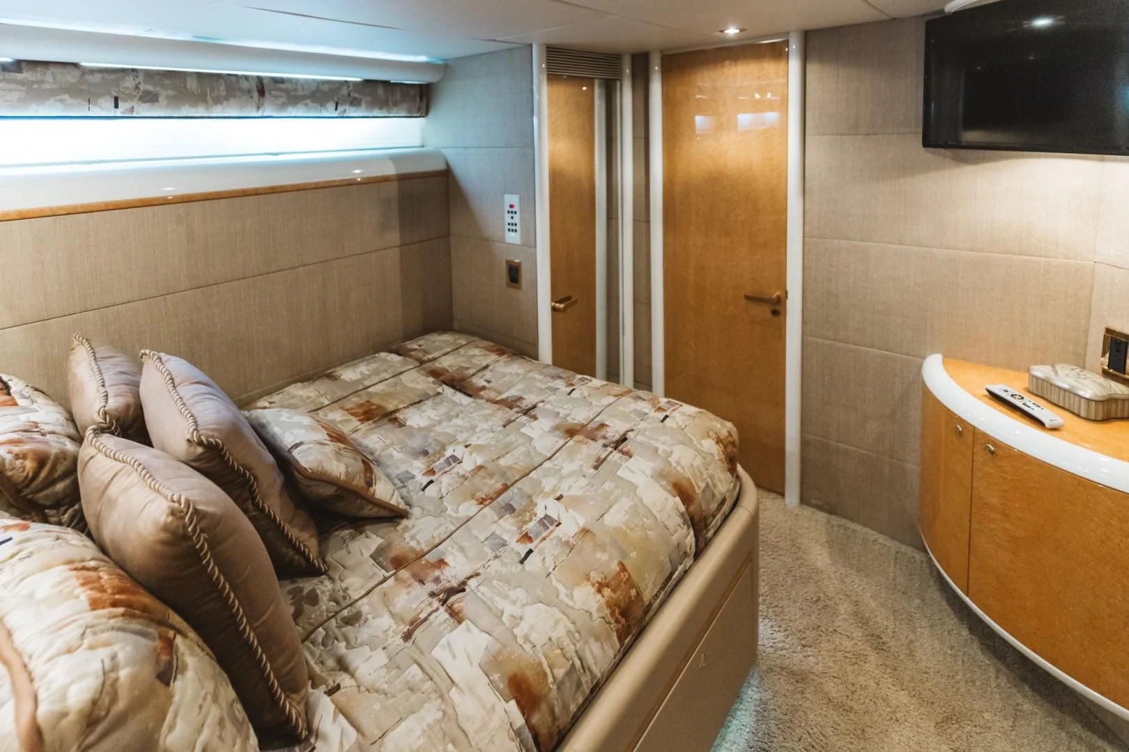 a bedroom with a bed and a television aboard DOUBLE EAGLE Yacht for Sale