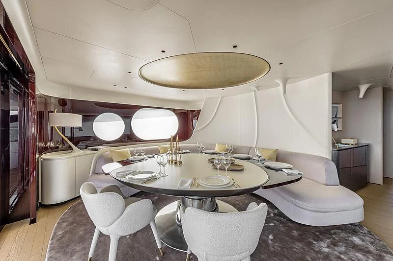 a dining room with a chandelier aboard SHABBY Yacht for Sale