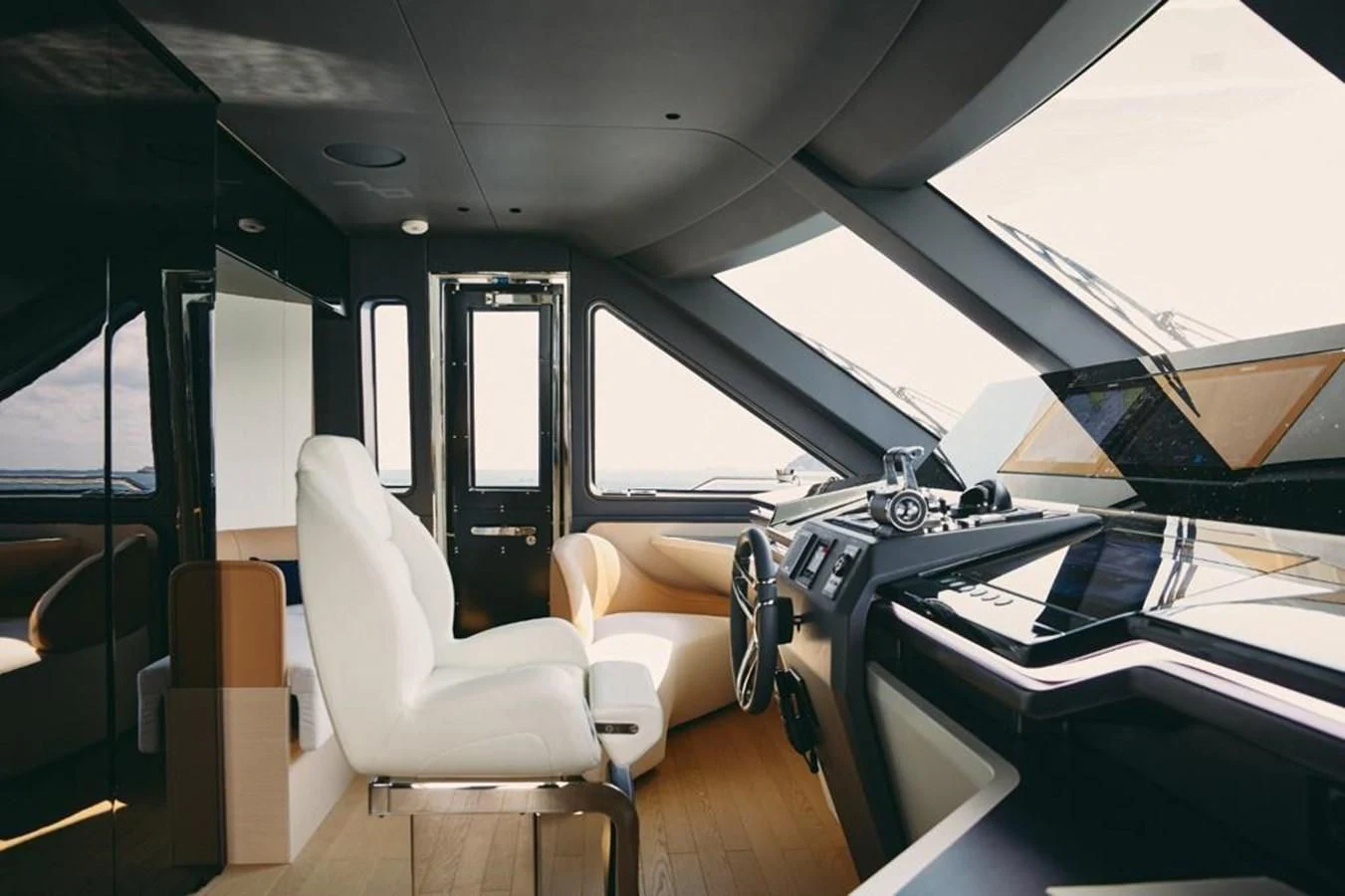 inside of a vehicle with a desk and chairs aboard SHABBY Yacht for Sale