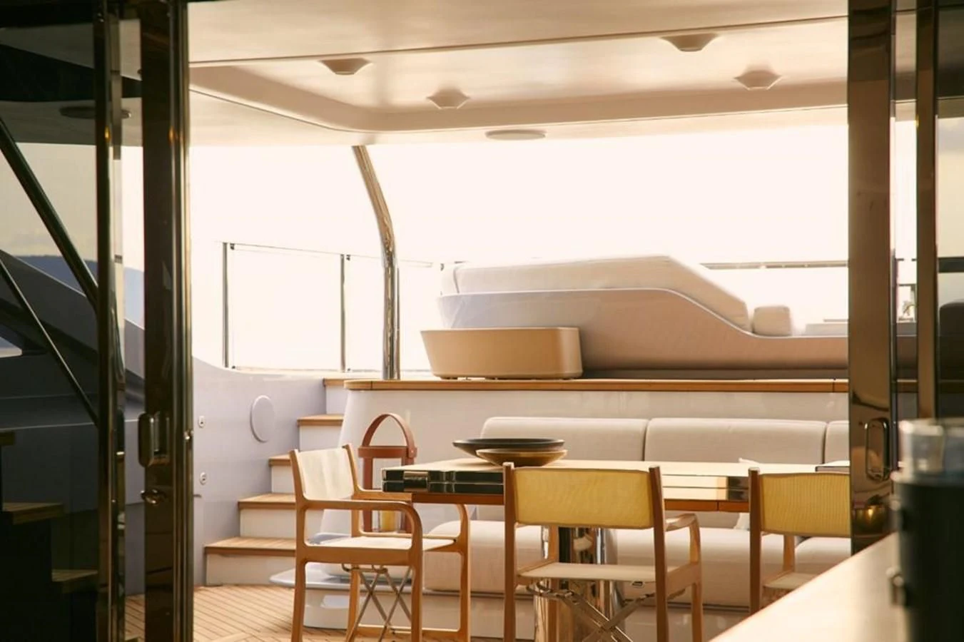 a room with tables and chairs aboard SHABBY Yacht for Sale
