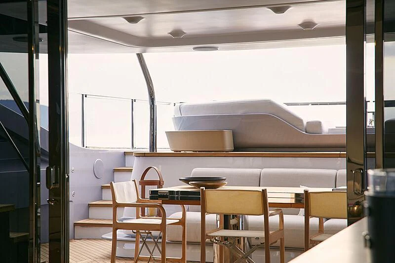 a kitchen with a table and chairs aboard SHABBY Yacht for Sale