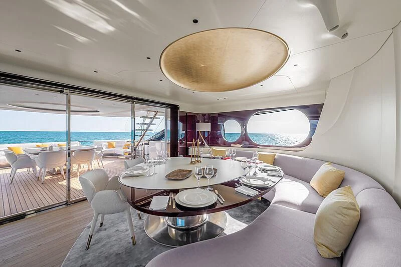 a room with a table and chairs aboard SHABBY Yacht for Sale