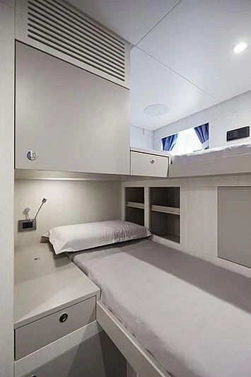 a room with a bed and a window aboard SHABBY Yacht for Sale