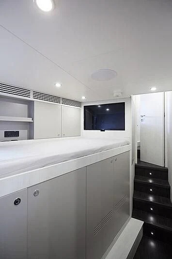 a room with a tv and cabinets aboard SHABBY Yacht for Sale