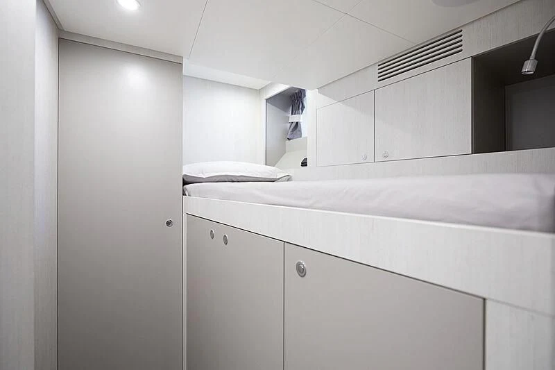 a white kitchen with white cabinets aboard SHABBY Yacht for Sale