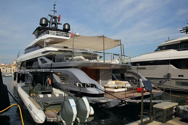 a large boat docked at a pier aboard SHABBY Yacht for Sale