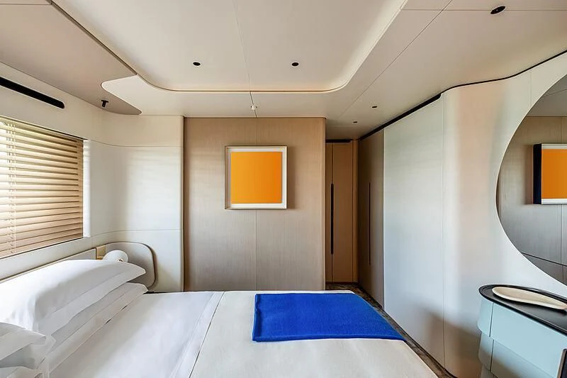 a room with a bed and a painting on the wall aboard SHABBY Yacht for Sale