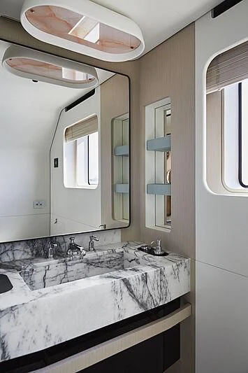 a bathroom with a large mirror aboard SHABBY Yacht for Sale