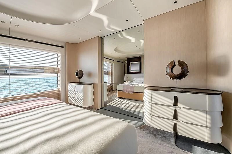 a bedroom with a large mirror aboard SHABBY Yacht for Sale