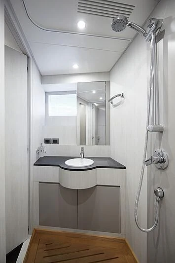 a bathroom with a sink and a shower aboard SHABBY Yacht for Sale