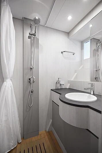 a bathroom with a sink and a shower aboard SHABBY Yacht for Sale