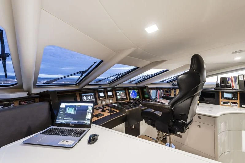 a room with a laptop and a chair aboard ANGKALIA Yacht for Sale