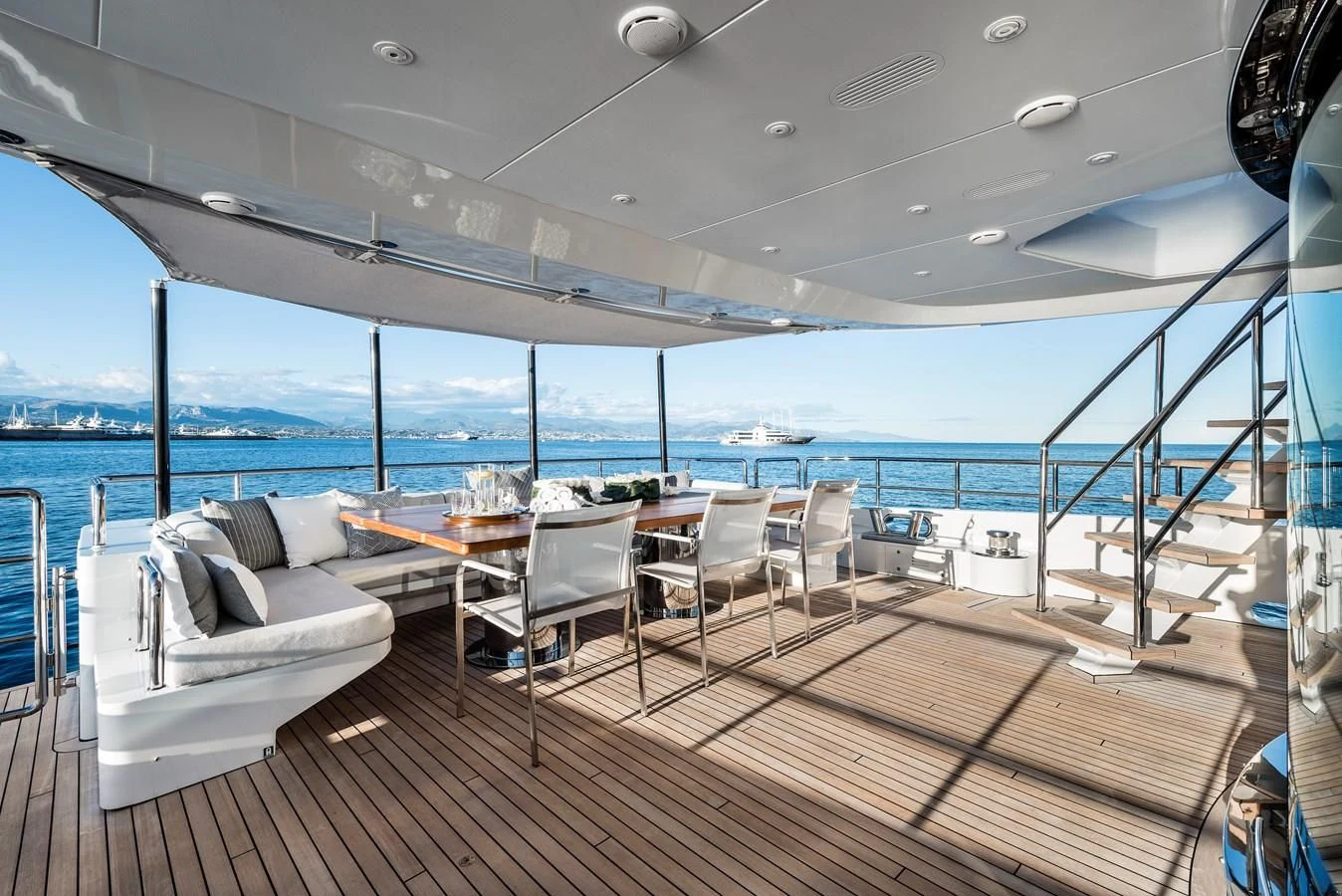a deck with a view of the ocean and the deck aboard ANGKALIA Yacht for Sale
