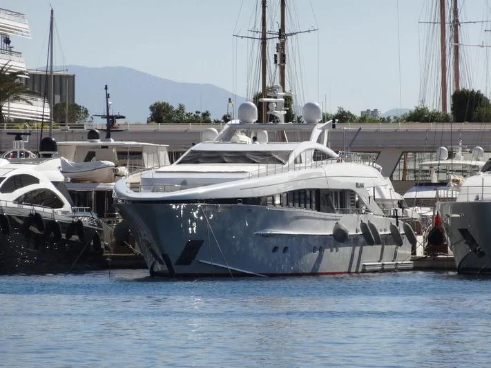 a boat docked at a pier aboard ANGKALIA Yacht for Sale