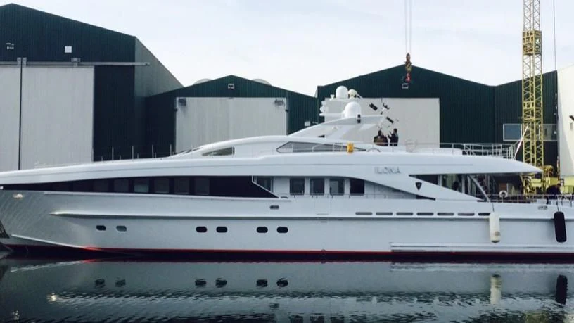 a white yacht in a dock aboard ANGKALIA Yacht for Sale