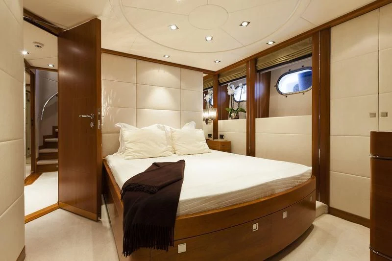 a bed in a room aboard ANGKALIA Yacht for Sale
