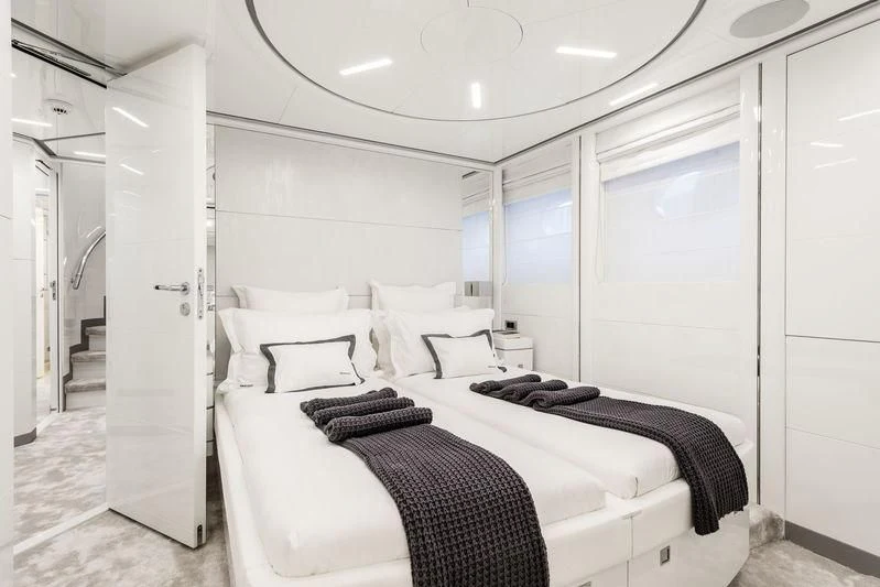 a bedroom with a bed aboard ANGKALIA Yacht for Sale