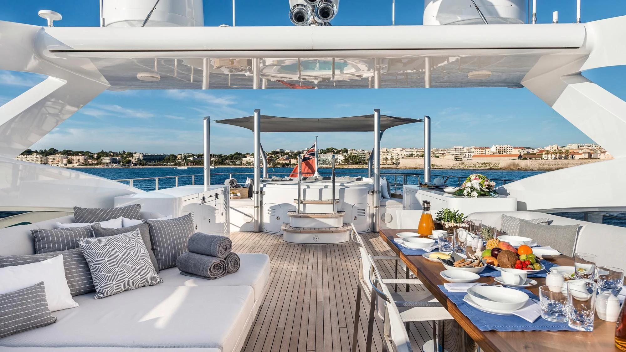 a room with a table and chairs and a large white ship aboard ANGKALIA Yacht for Sale