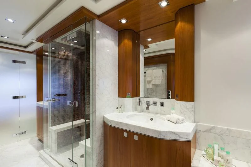 a bathroom with a large mirror aboard ANGKALIA Yacht for Sale