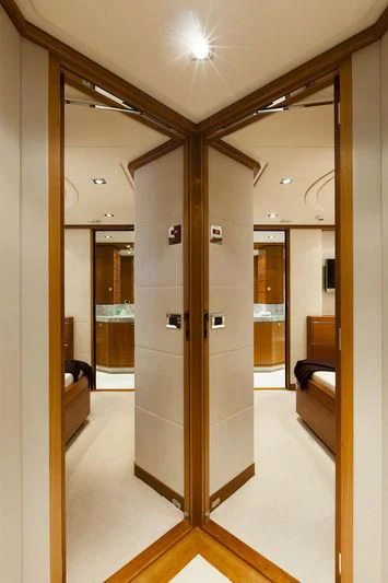 a room with a glass door aboard ANGKALIA Yacht for Sale