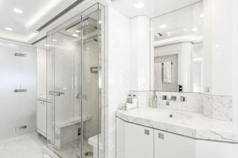 a bathroom with a large mirror aboard ANGKALIA Yacht for Sale