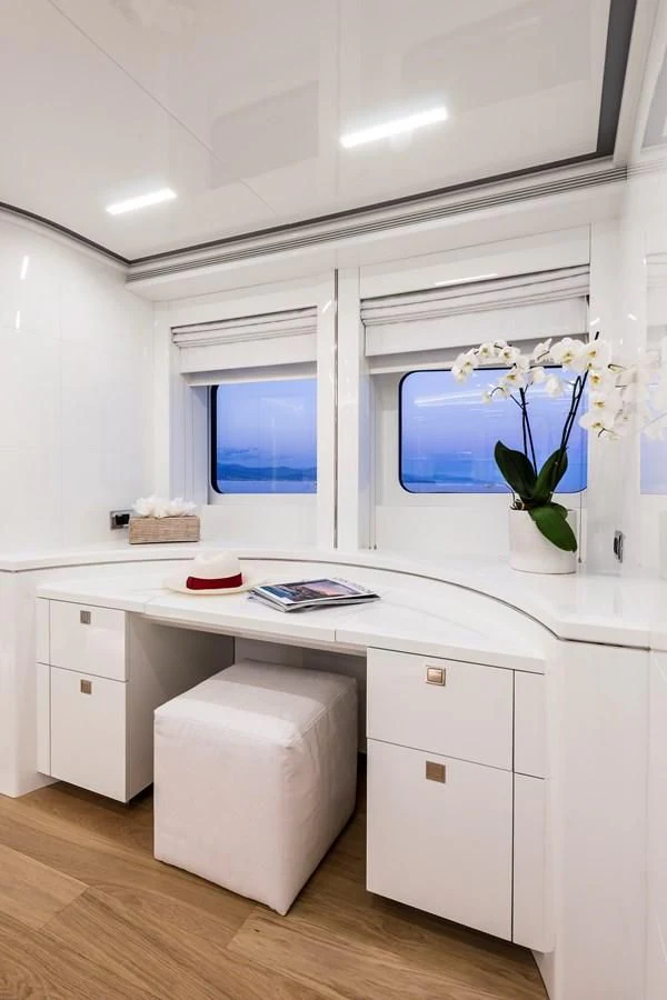 a white kitchen with a white counter aboard ANGKALIA Yacht for Sale