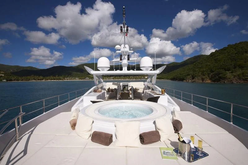 a white boat on a body of water aboard ANGKALIA Yacht for Sale