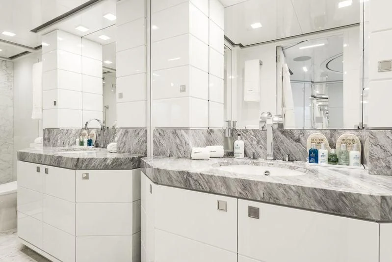 a bathroom with a large mirror aboard ANGKALIA Yacht for Sale