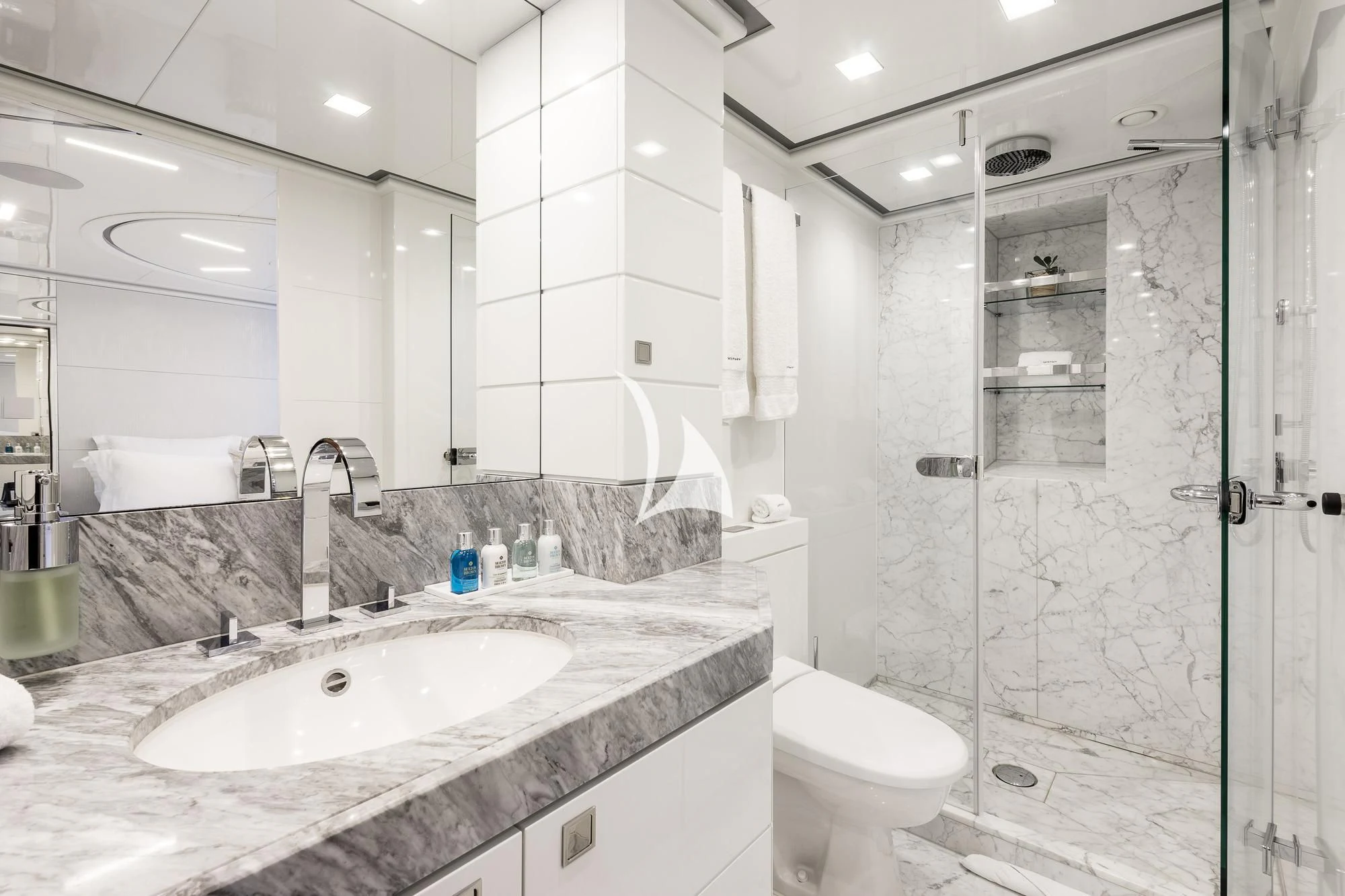 a bathroom with a glass shower aboard ANGKALIA Yacht for Sale