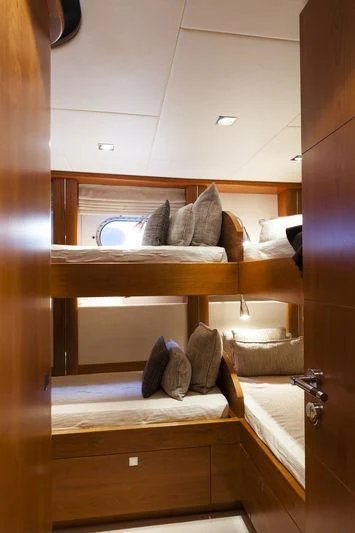 a wooden shelf with a mirror above it aboard ANGKALIA Yacht for Sale