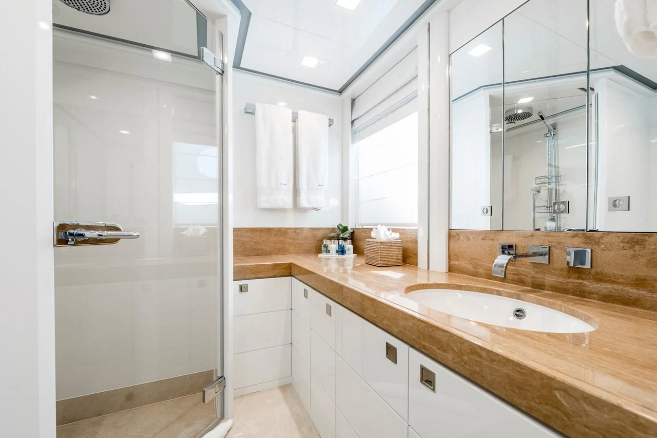 a bathroom with a large mirror aboard ANGKALIA Yacht for Sale