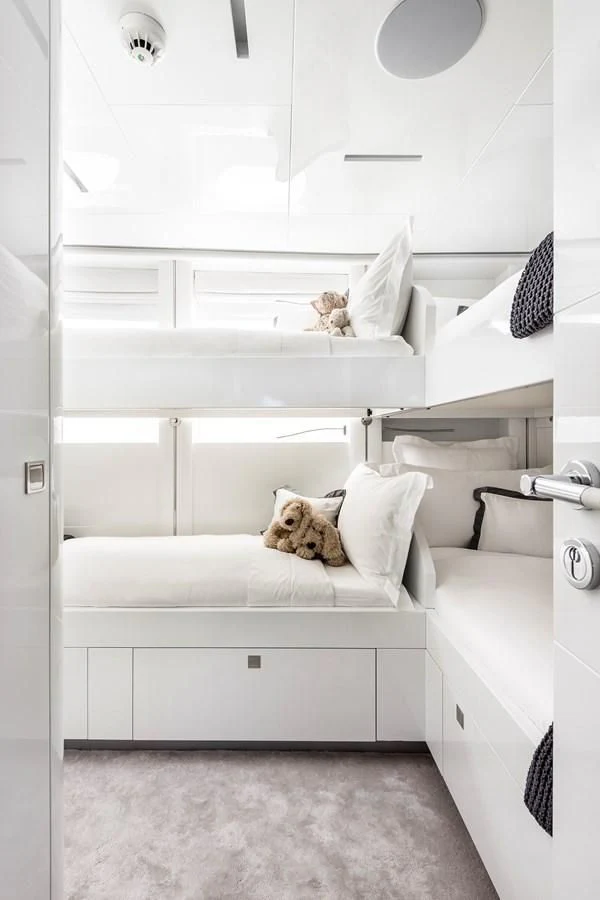 a cat lying on a bed aboard ANGKALIA Yacht for Sale