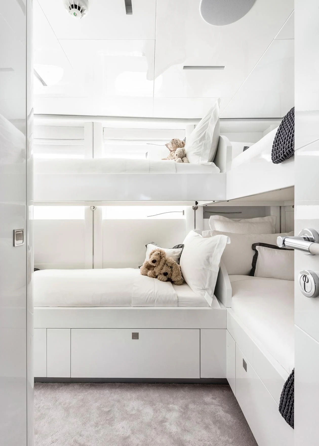 a cat lying on a bed aboard ANGKALIA Yacht for Sale