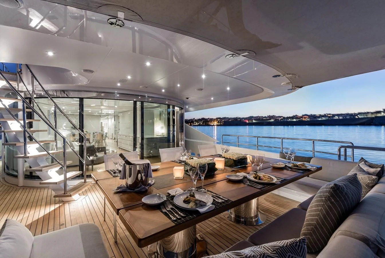 a modern looking living room with a large glass wall aboard ANGKALIA Yacht for Sale