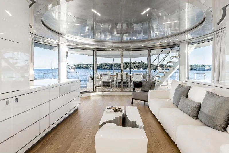 a living room with a large glass window aboard ANGKALIA Yacht for Sale