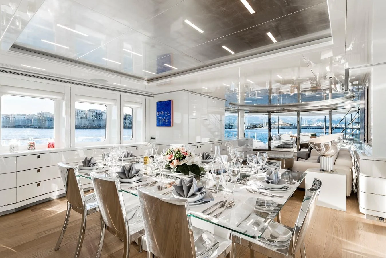 a room with tables and chairs aboard ANGKALIA Yacht for Sale
