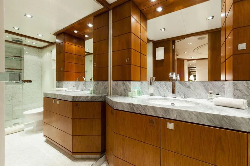 a bathroom with a large mirror aboard ANGKALIA Yacht for Sale